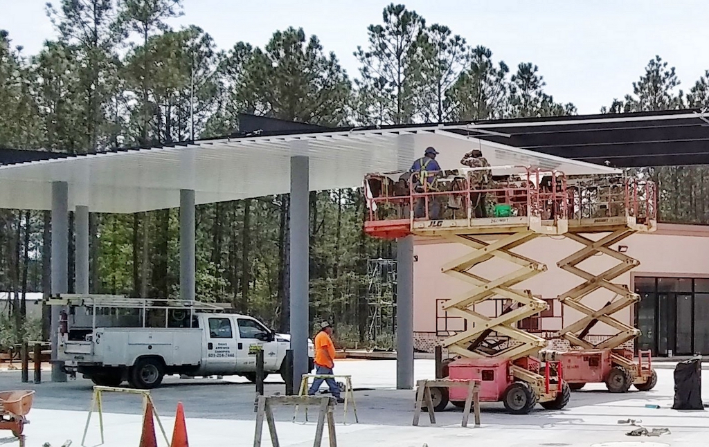 workers and tools on a scissor lift