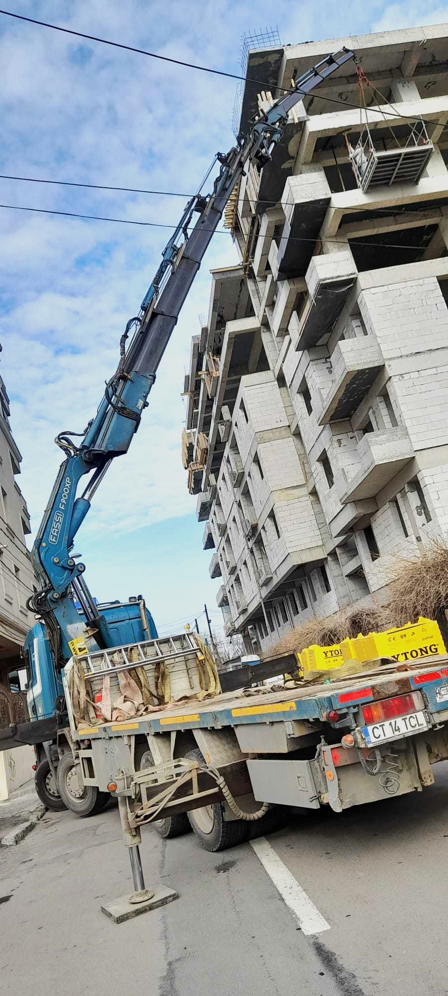 raising construction materials using a truck crane