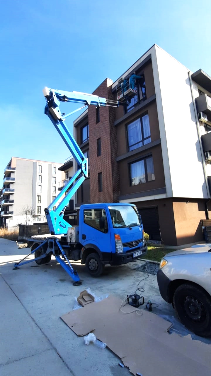 roller shutter dismount using a truck-mounted boom lift