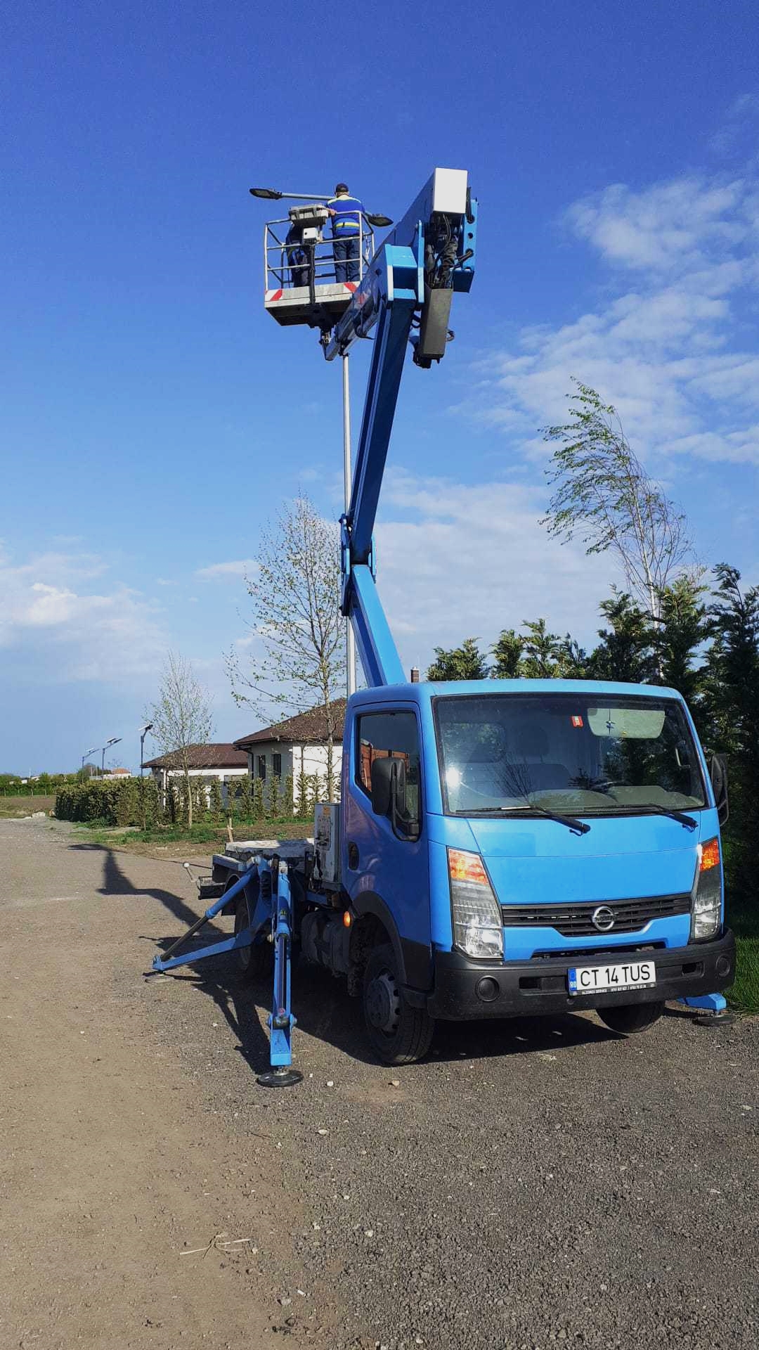 Light installation in a pole using a truck-mounted boom lift