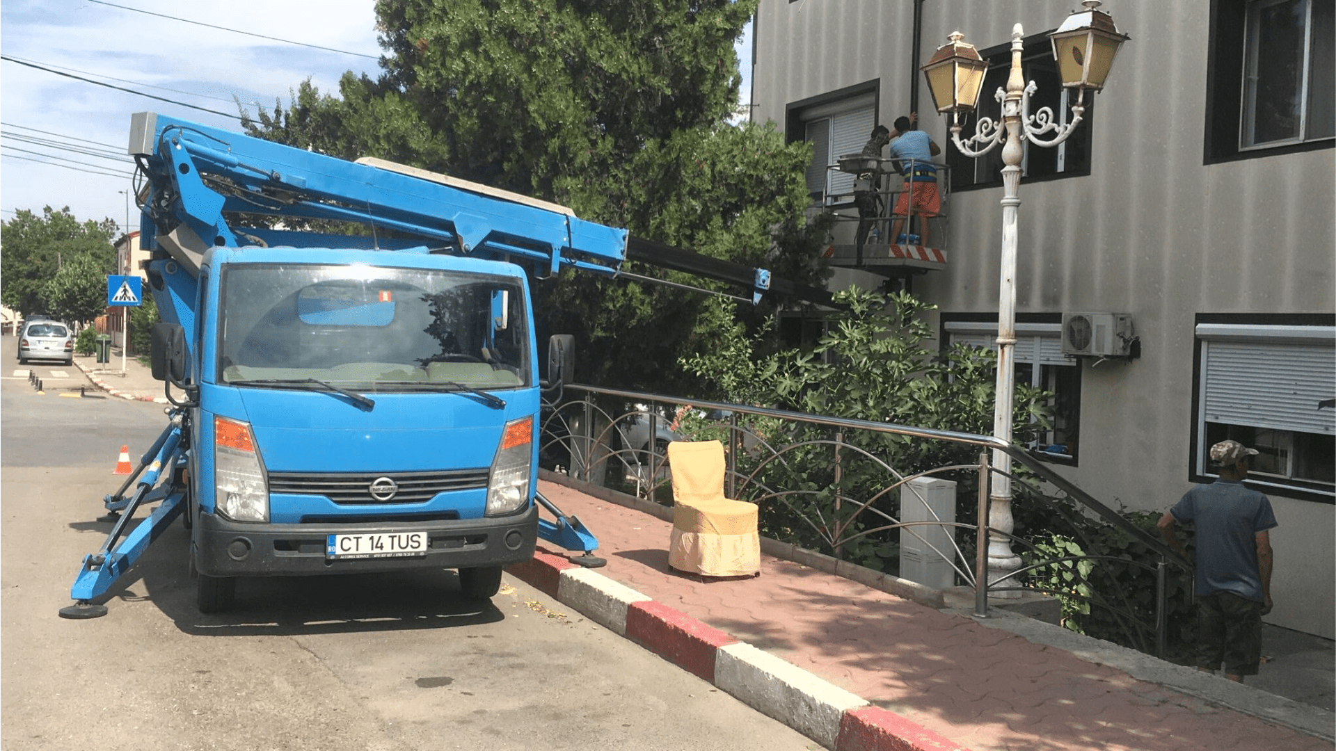 Using a truck-mounted boom lift for a gutter replacement project