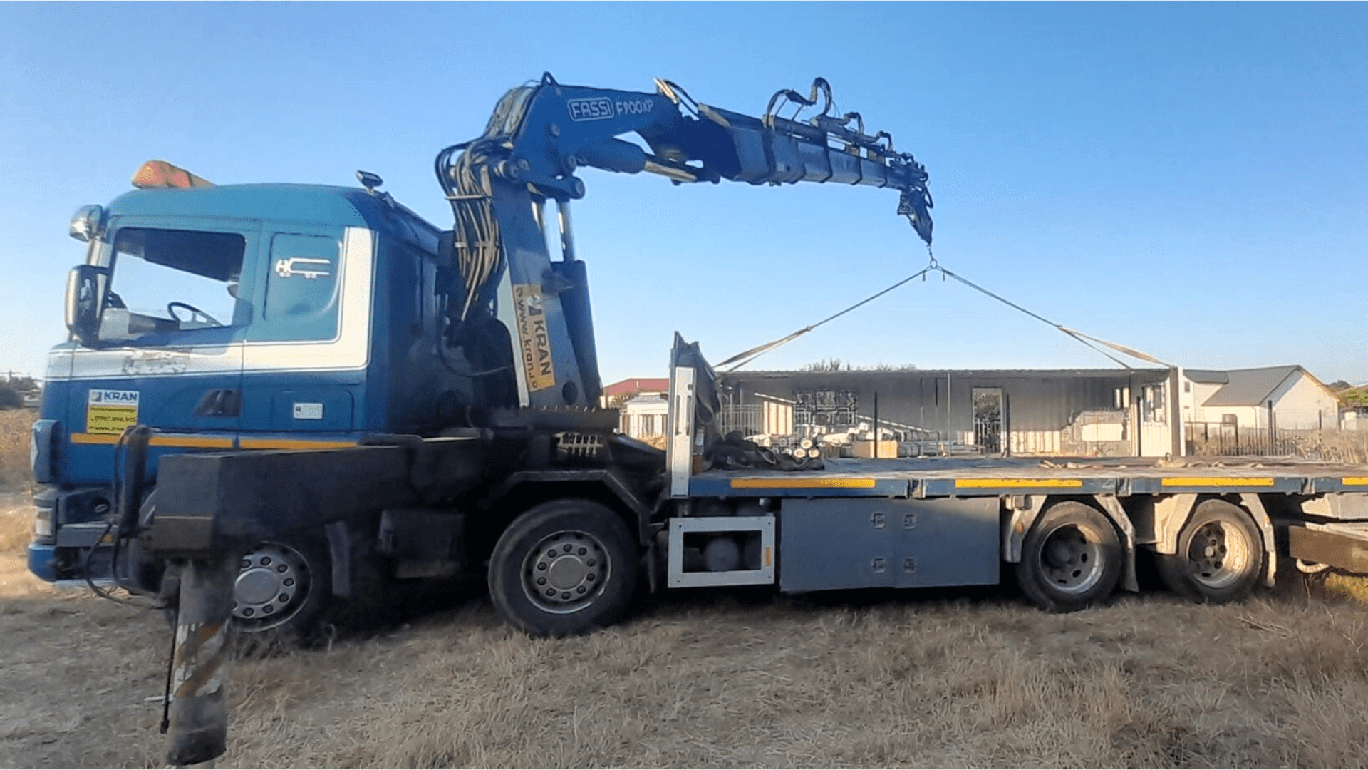 Transportation and Unloading Containers using a Truck-Crane